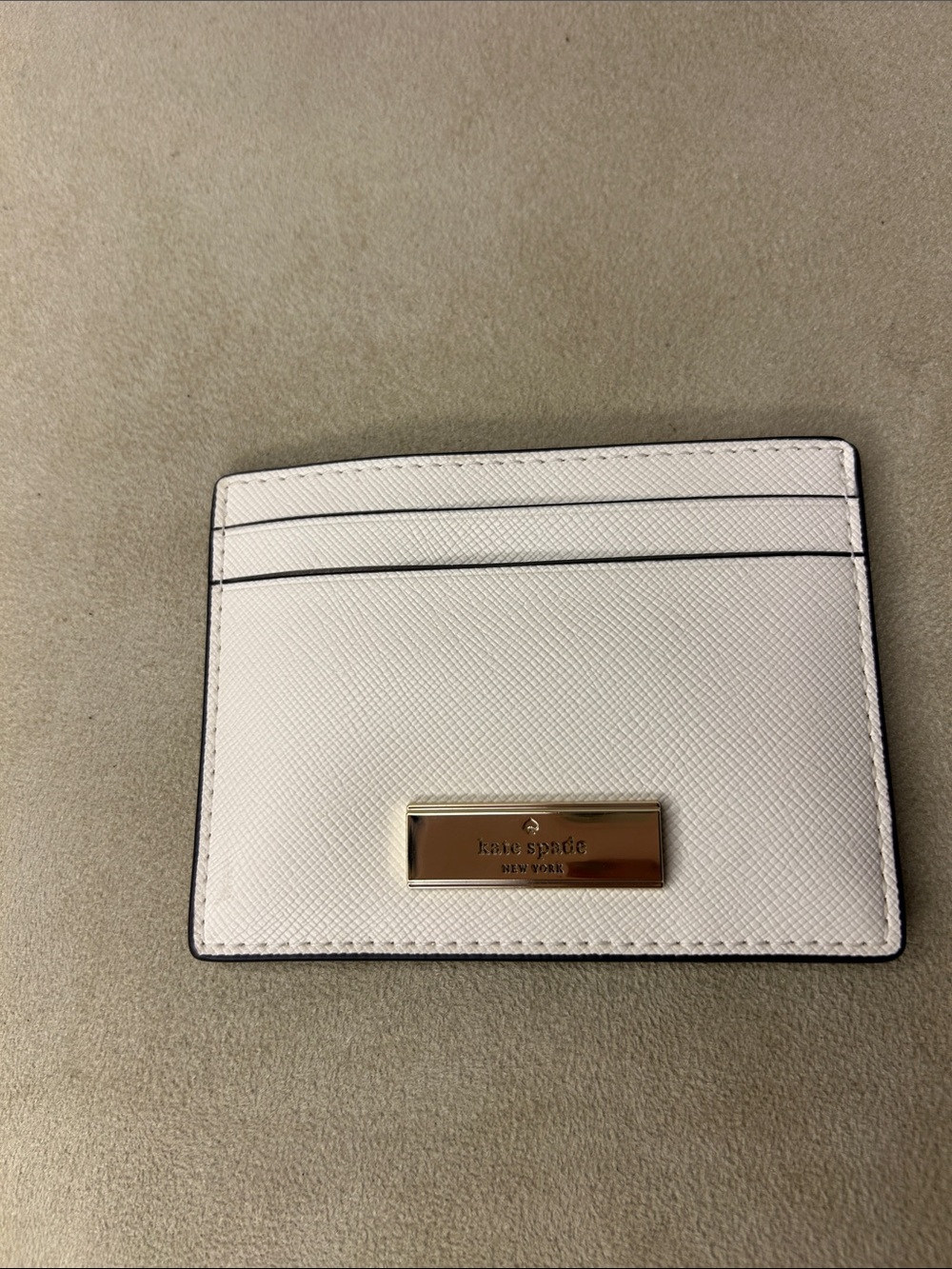 kate spade Bridget crinkle patent cream colored slim card holder
